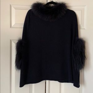 Navy knit poncho with fur trim